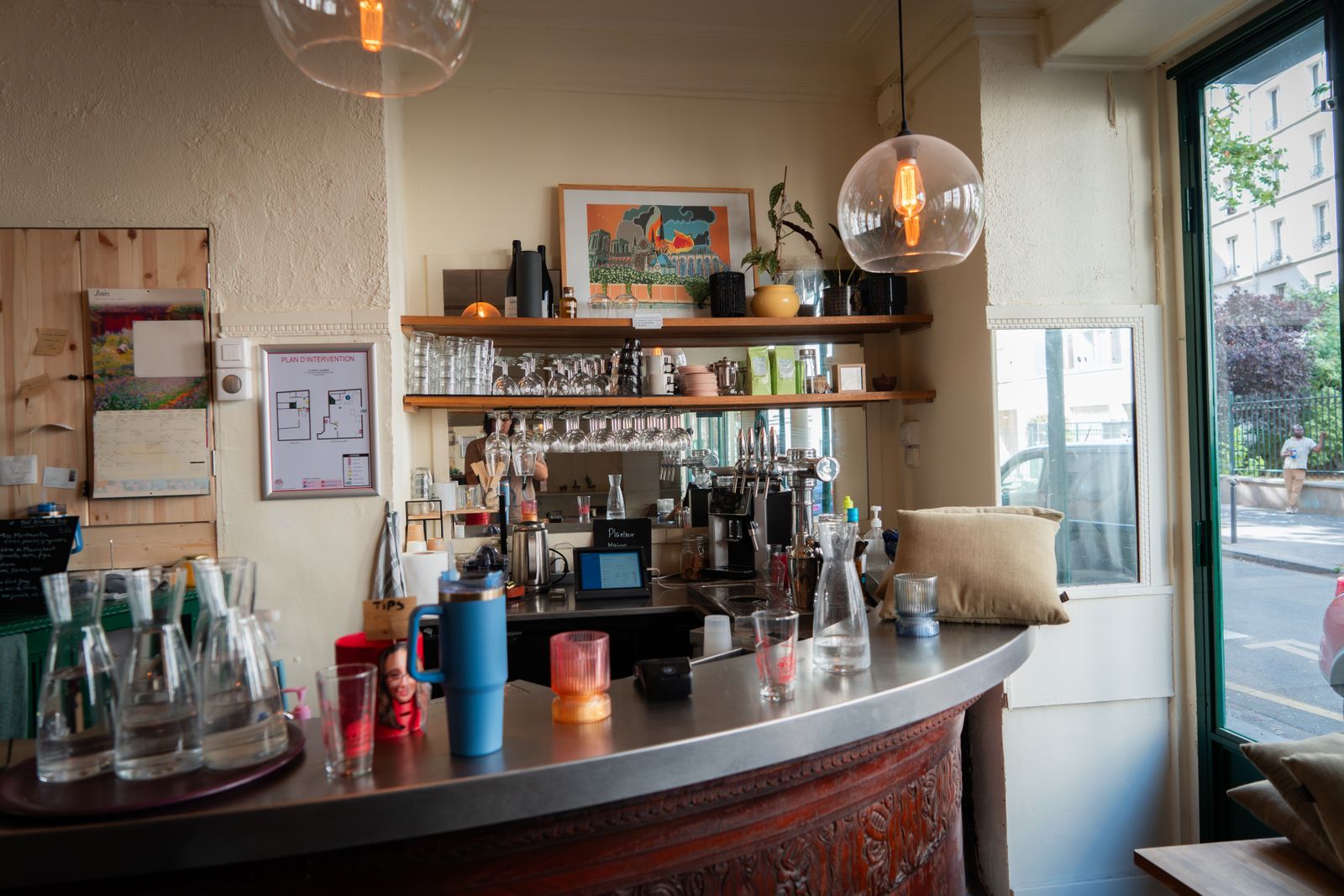 The café counter with the espresso machine and fresh bakes