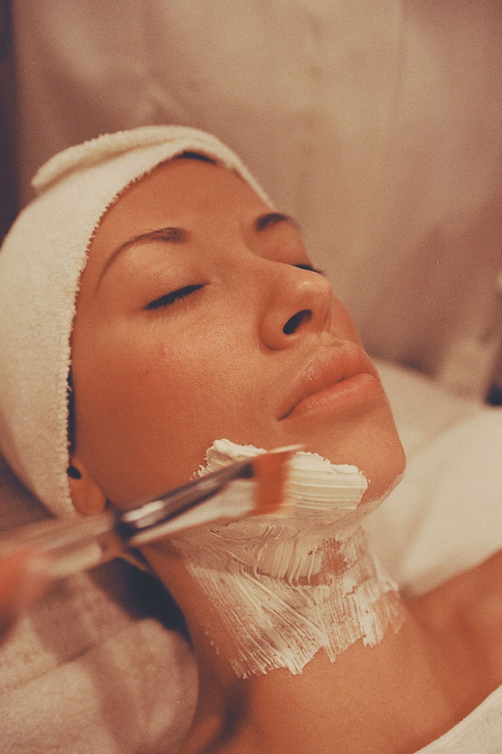 A guest relaxing during a facial