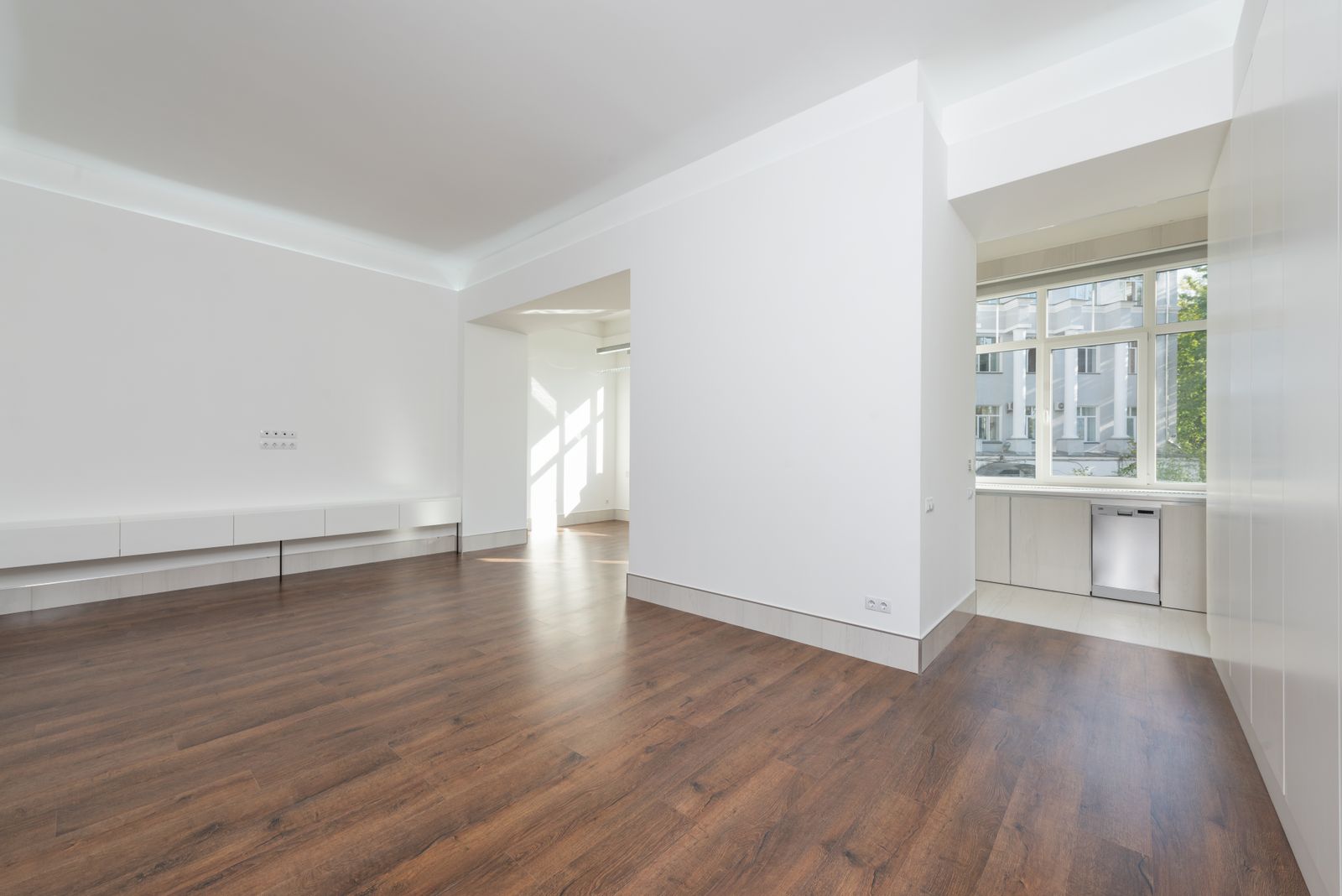 The living room before the redesign, with bare walls and boxes