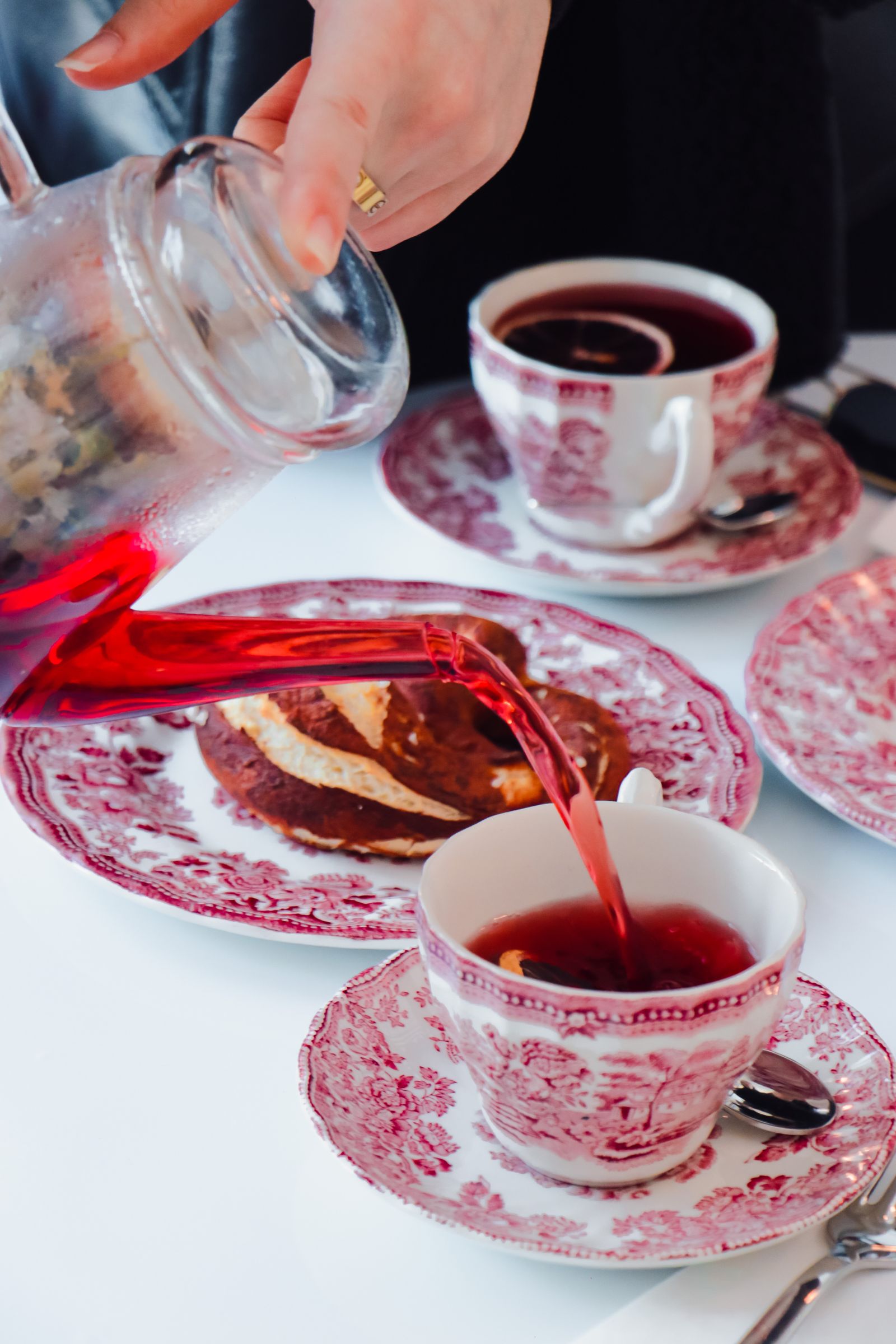 A teapot and a cup of freshly brewed tea on a table