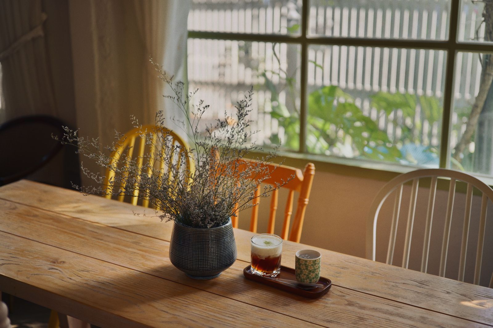 Inside the tea room: a window table set for two