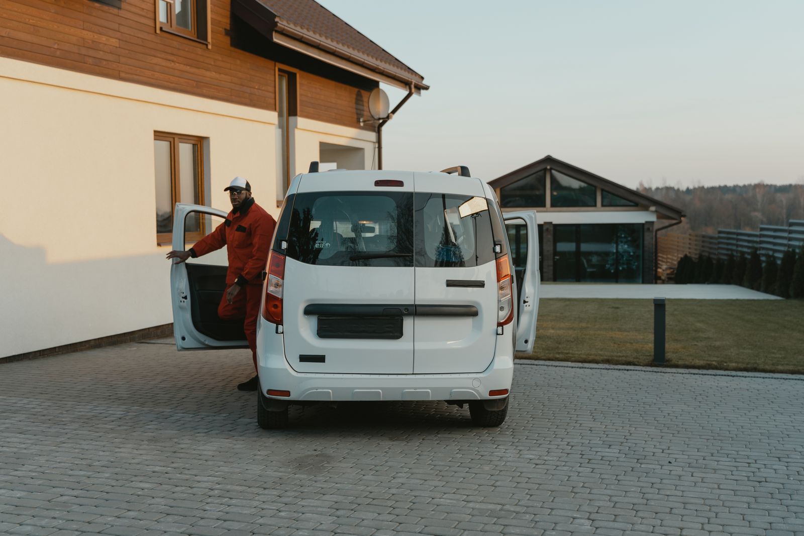 A heating and cooling service van on a residential street
