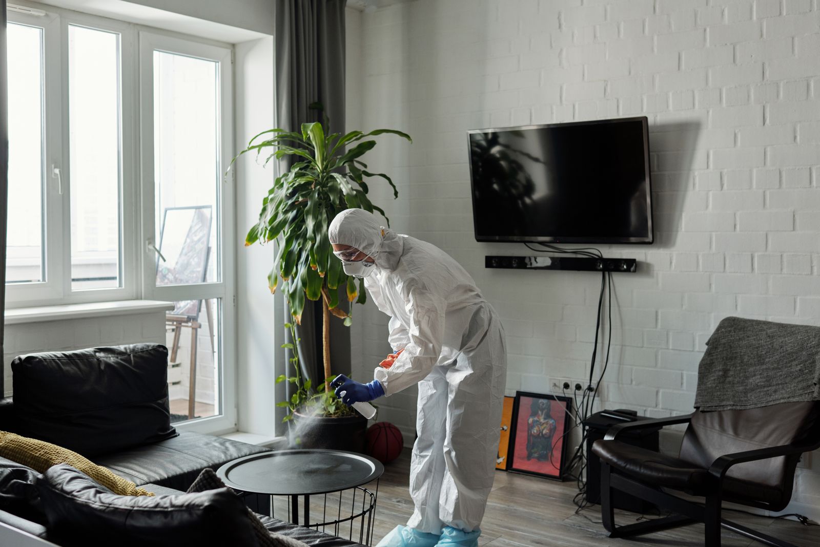 Illustration of a technician treating the outside of a house