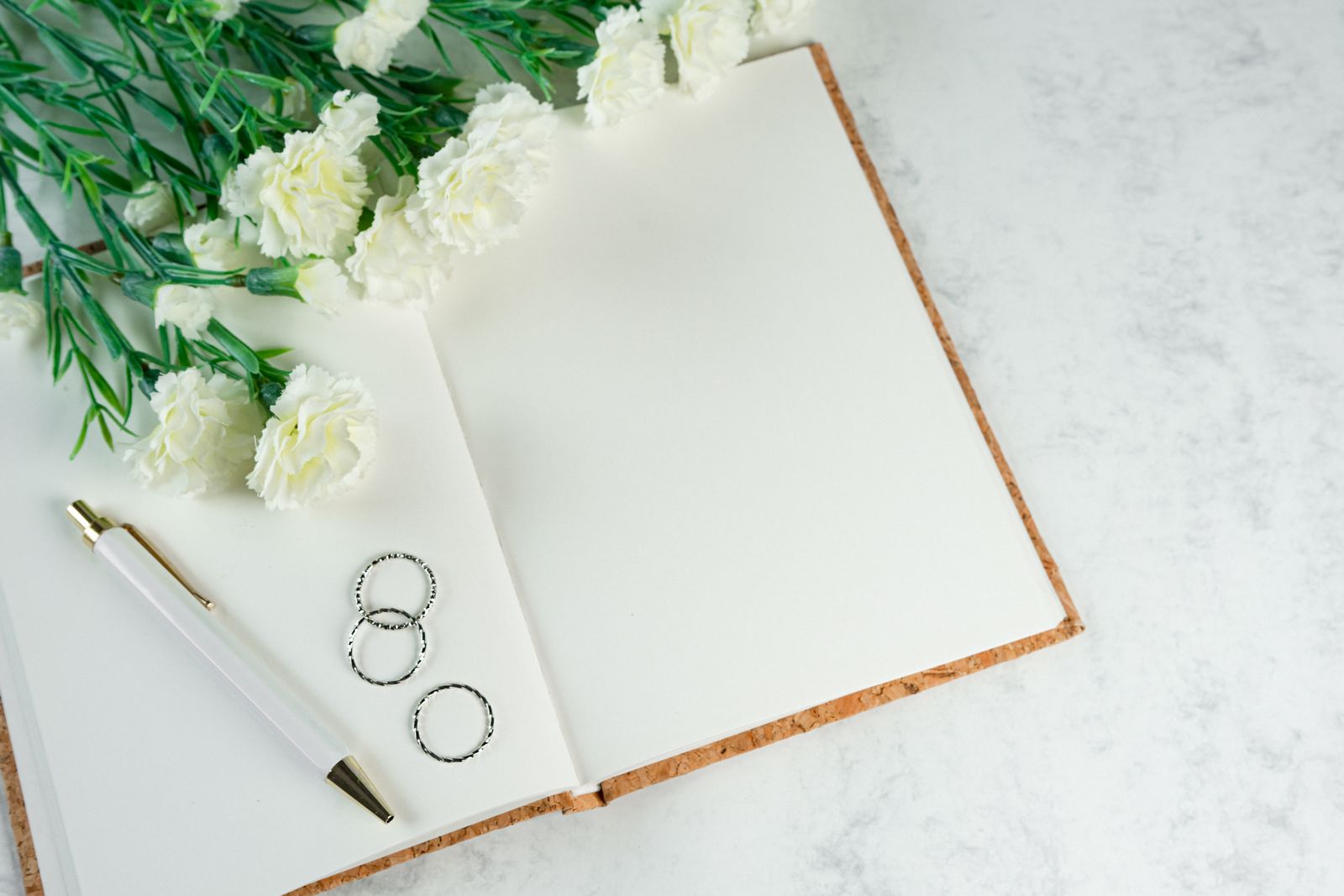 A planning desk with colour swatches, notes and flowers