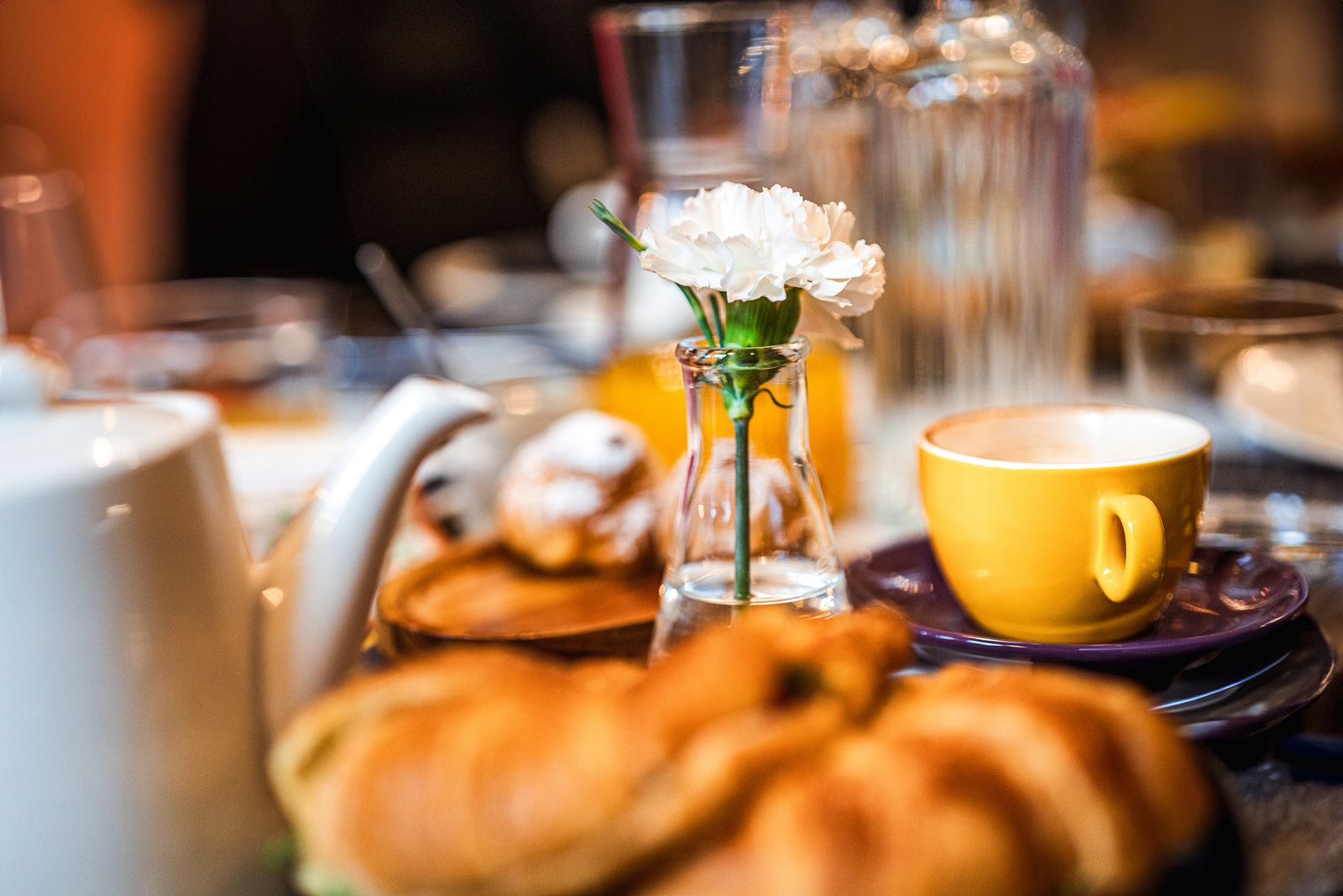 Coffee, pastries and homemade jam on the breakfast table