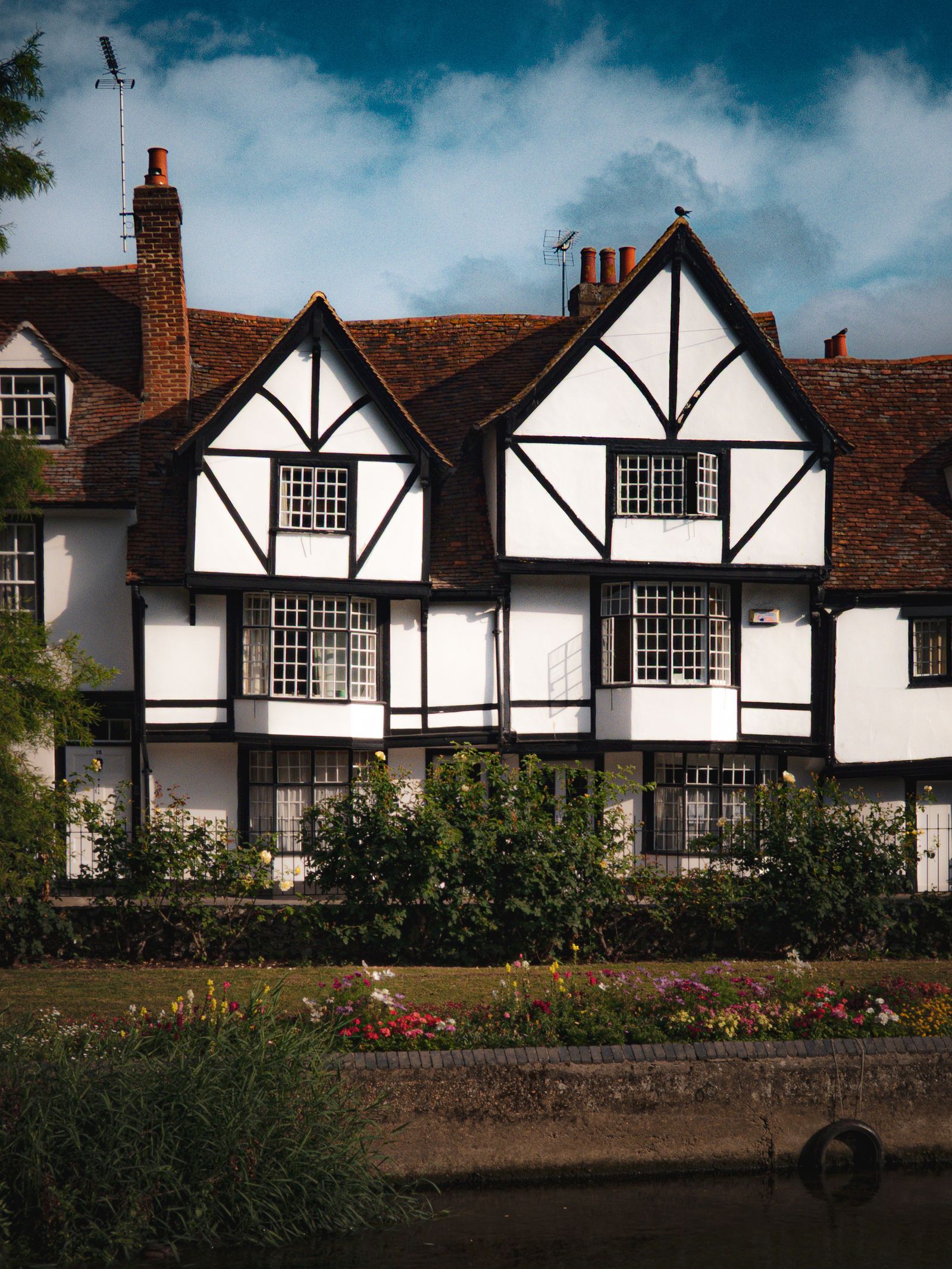 The front of the inn with its green door and garden