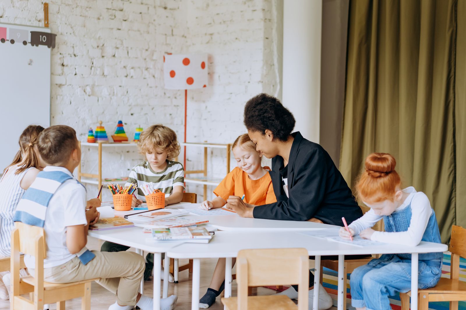 Illustration of two children reading and writing together at a table