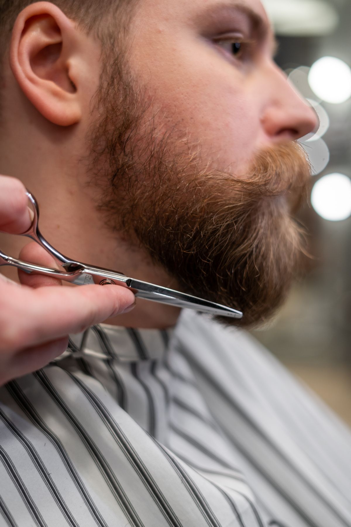 A neatly shaped full beard
