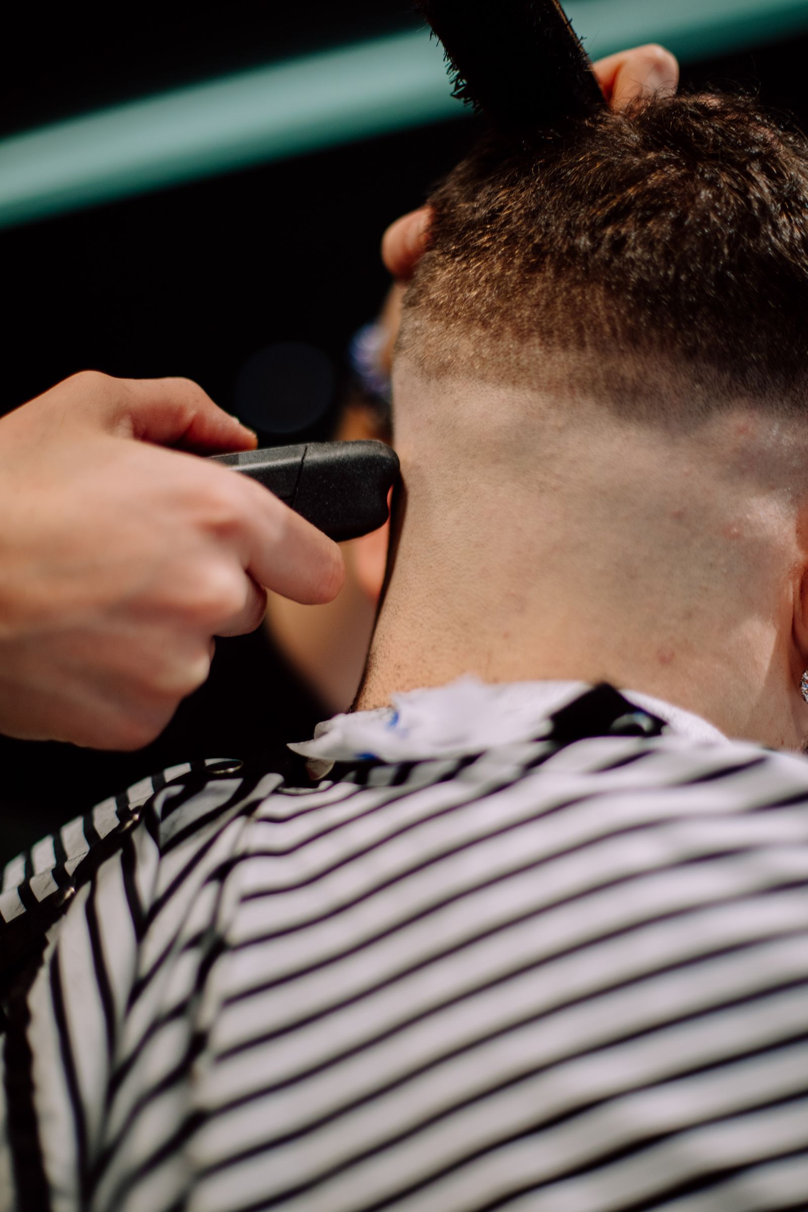 A textured crop haircut with a short fringe