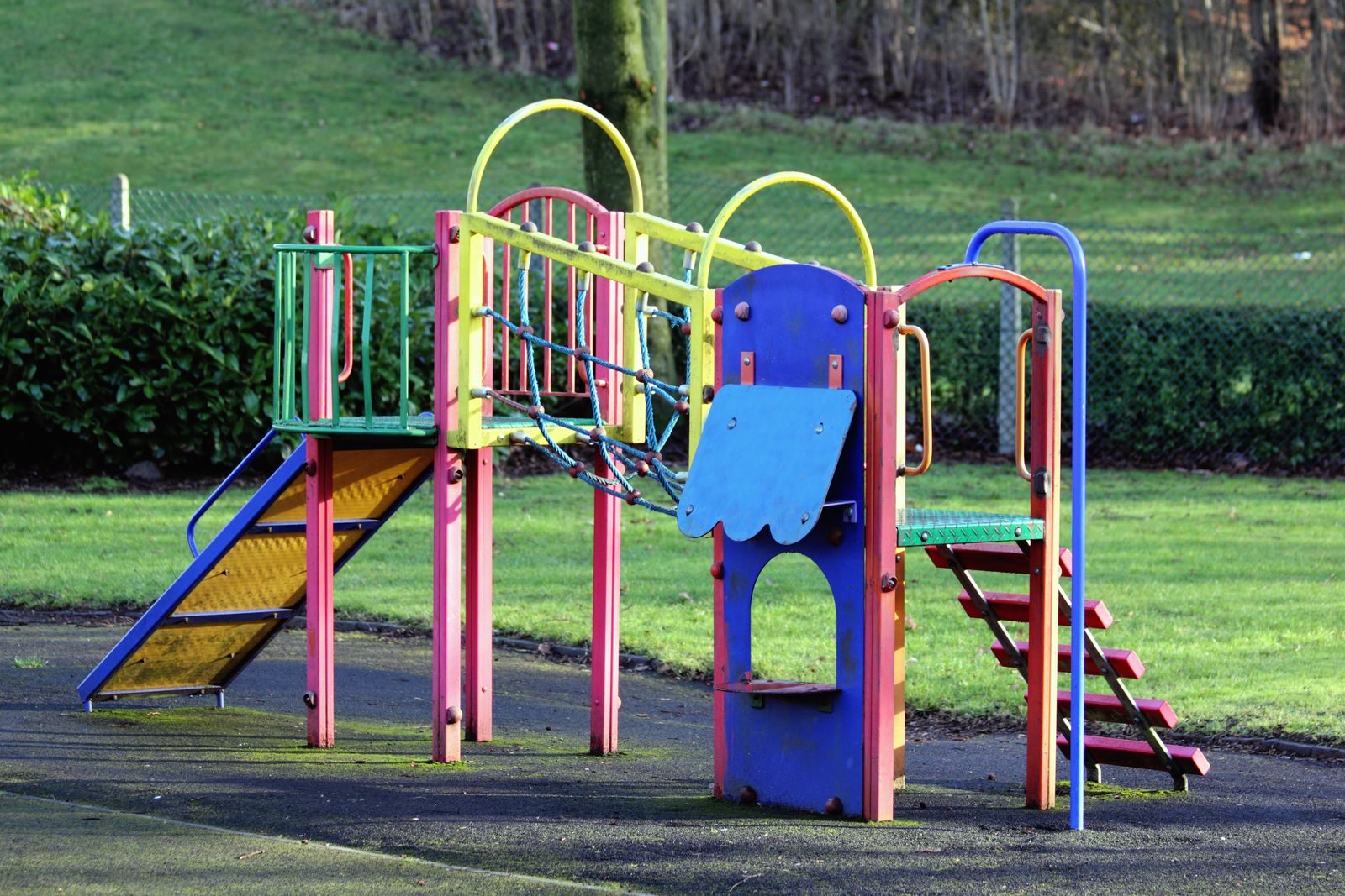 Illustration of the nursery playground with a slide and swings