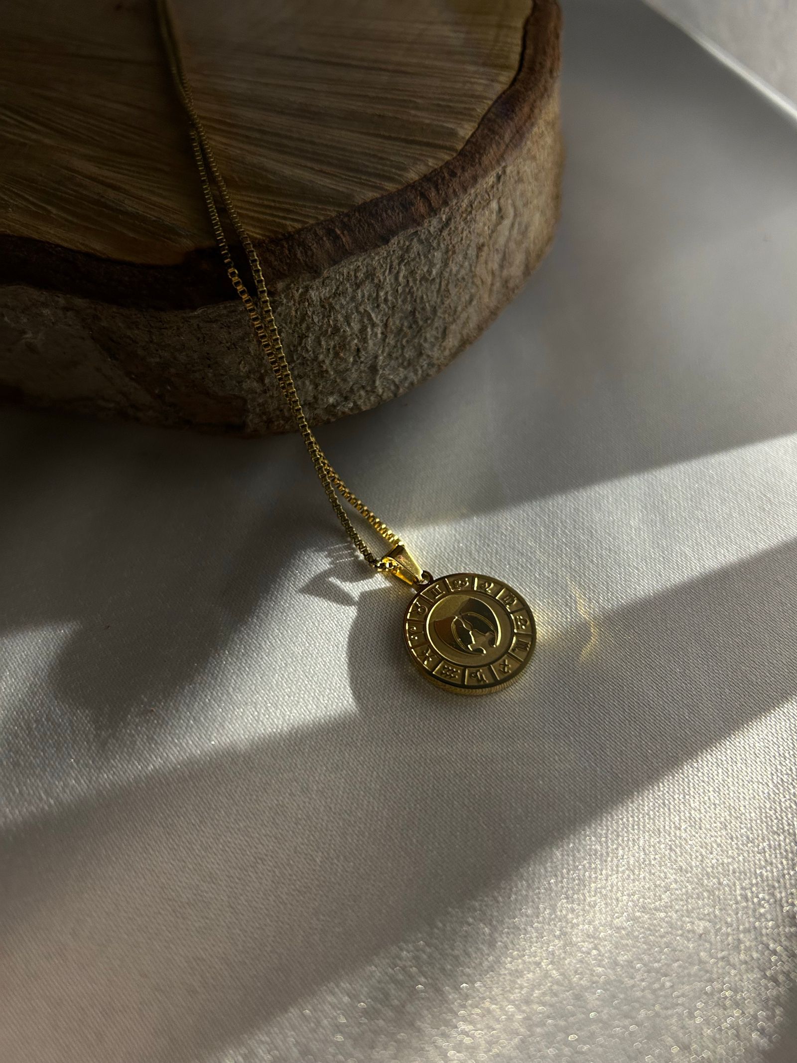 Engraved coin pendant