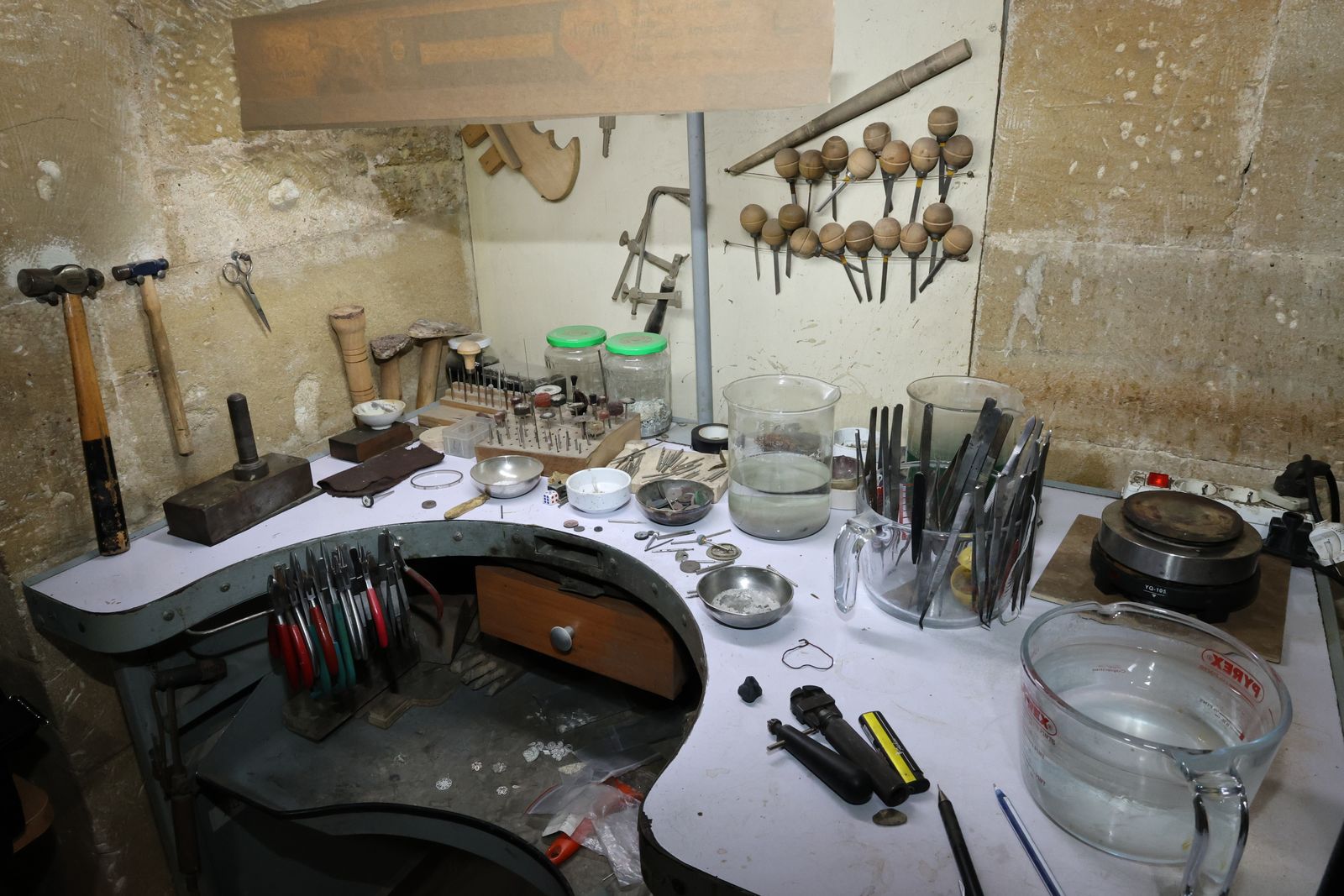 A jeweller’s workbench with hand tools