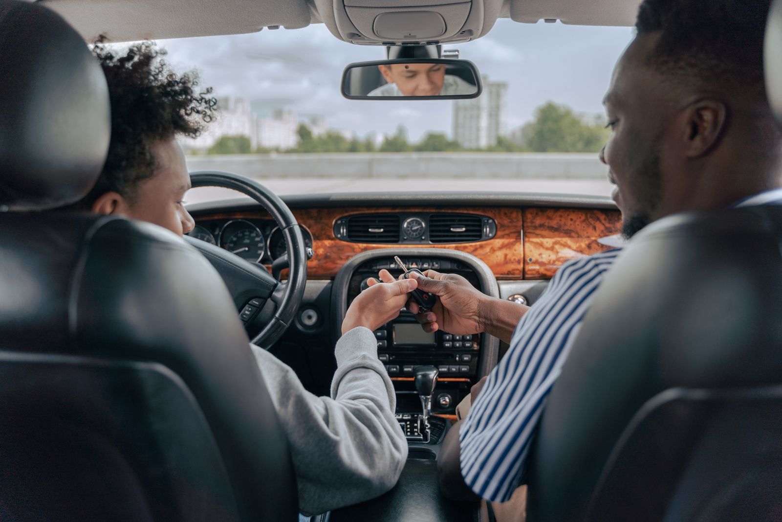 A learner driver and an instructor in a driving school car
