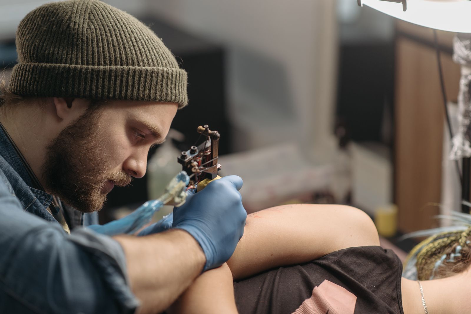 Illustration of a tattoo artist at work in the studio