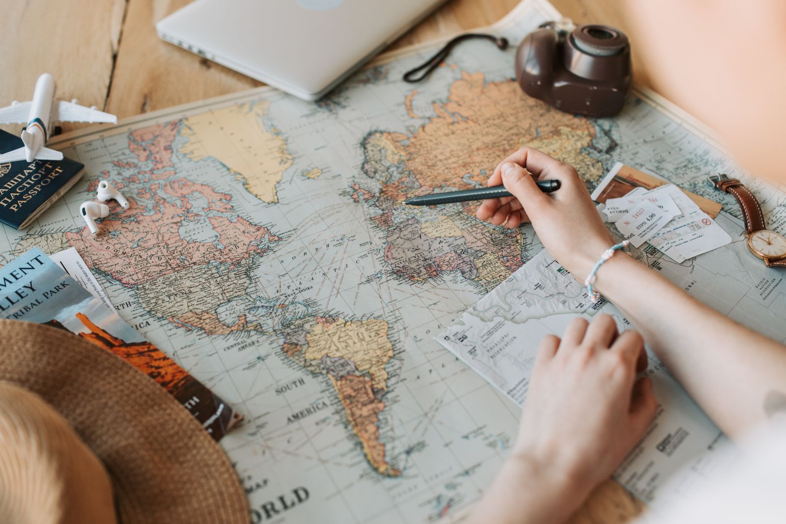 A suitcase, globe and passport ready for a trip
