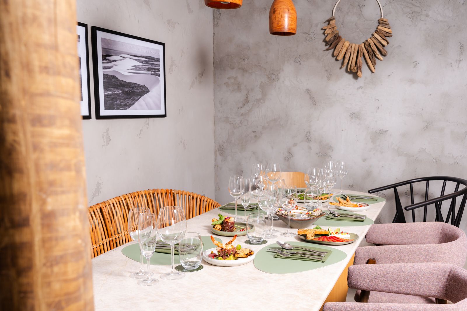 The private dining room with a long table set for dinner