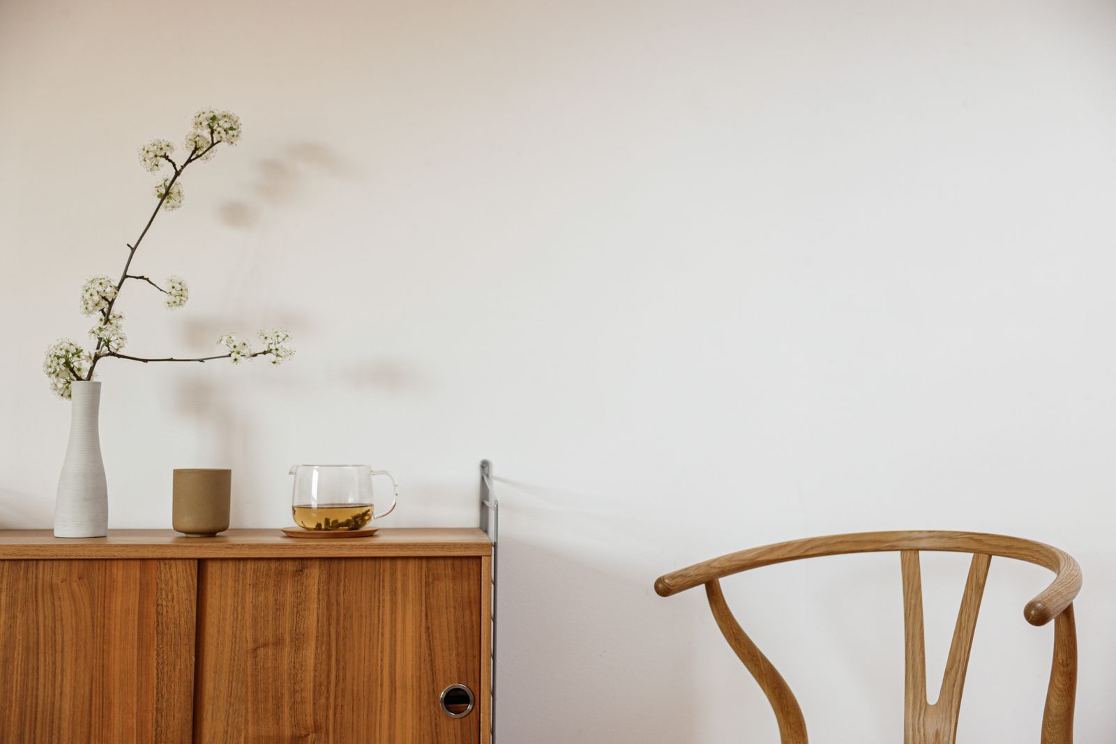 A quiet room with flowers on a table