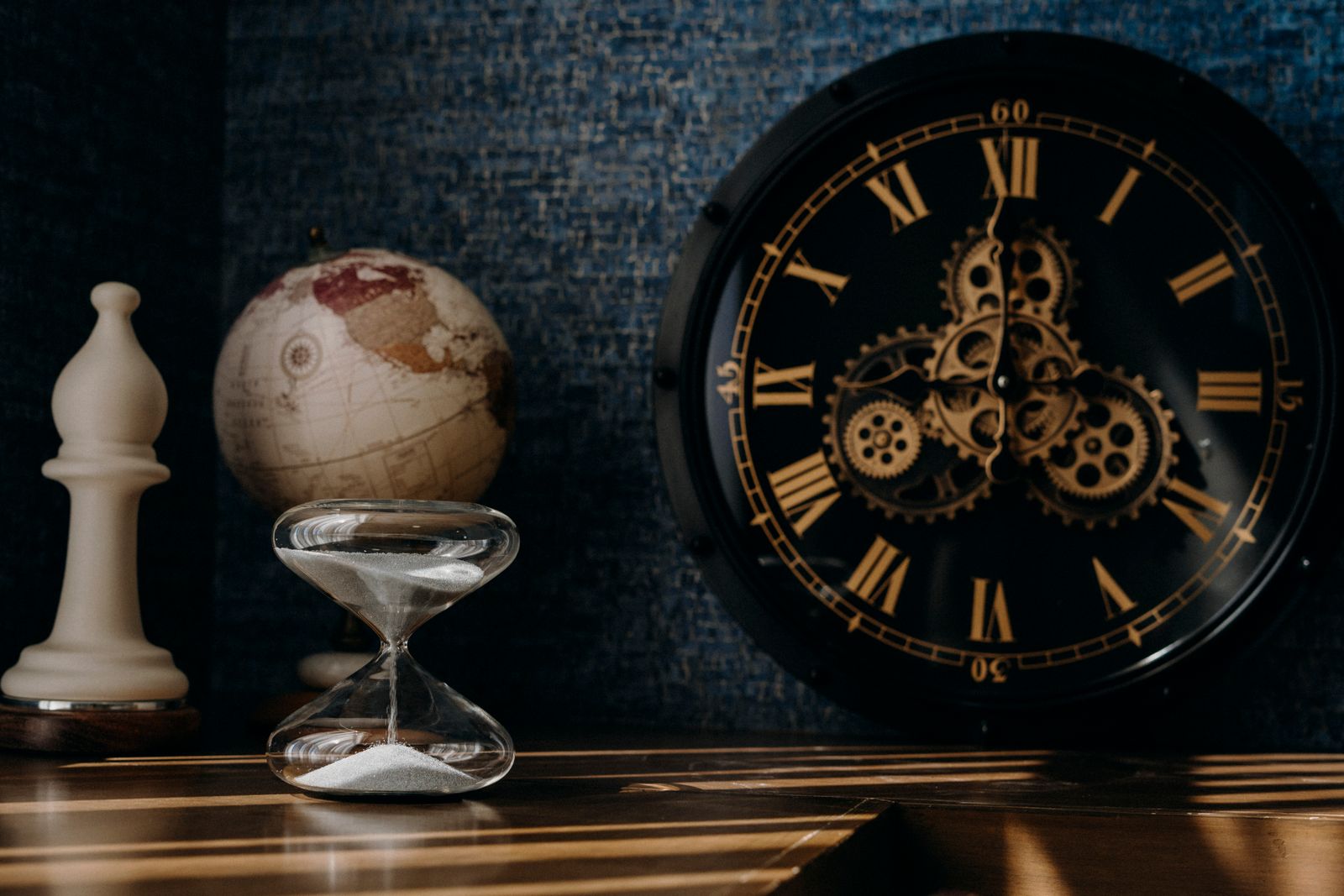 An attic full of old clocks, a globe and an hourglass