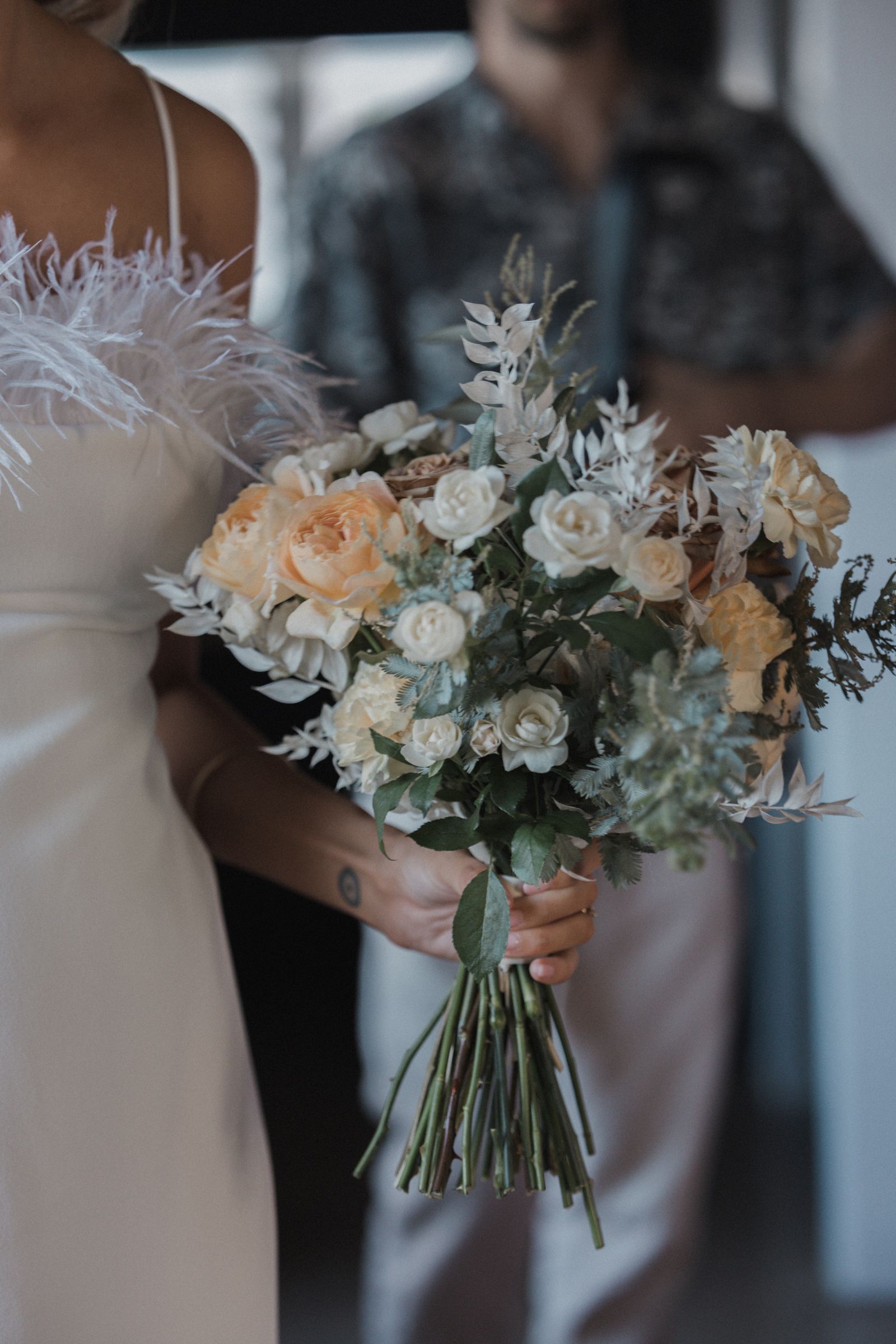 Wedding bouquet of white and blush flowers